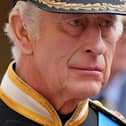 King Charles III follows the coffin of Queen Elizabeth II as it travels inside Windsor Castle on September 19. 