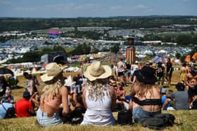 Festivalgoers enjoy the sun and warm weather as they attend Glastonbury 2022 (Photo: ANDY BUCHANAN/AFP via Getty Images)