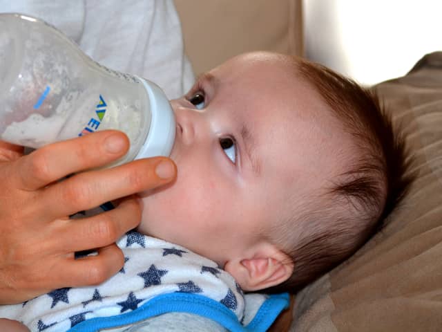 A baby drinks formula from a bottle. Pic: Pixabay.