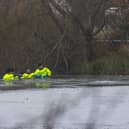 Rescue teams searching the freezing lake in Solihull for survivors.