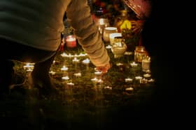 An organised candelit vigil at Babbs Mill Lake where a group of children fell through the ice on Sunday. Three of those children have died while a fourth, aged six, is fighting for his life in hospital.