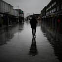 Dismal weather heralds the arrival of the UK Chancellor’s Autumn Statement as people shop in the centre of Bolton.