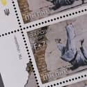 Ukraine postage stamps depicting a Banksy mural