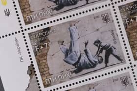 Ukraine postage stamps depicting a Banksy mural