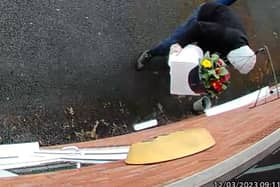 Owner Kim Hughes was left “mortified” when she watched back the footage and saw the hooded man walking off with the box filled with letters to dead relatives. 