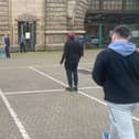 The cricketers passing the time at Dover with an impromptu match (Photo: SWNS)