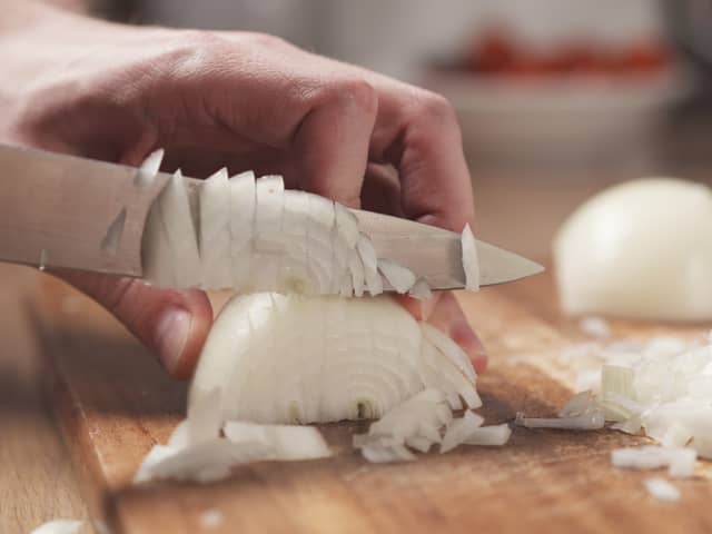 Putting a wet paper towel next to the chopping board supposedly helps stop your eyes from watering (Photo: Adobe)