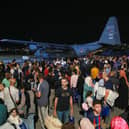 People evacuated from Sudan arrive at a military airport in Amman on 24 April 2023 (Photo: KHALIL MAZRAAWI/AFP via Getty Images)