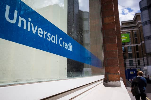 A Universal Credit sign in the window of the Job Centre in Westminster.
