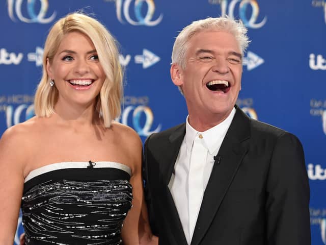 Holly Willoughby (left) and Phillip Schofield (right) put up a united front in Monday's episode of This Morning after rumours of a bitter feud between the hosting duo - Credit: Getty