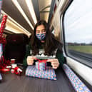 Professional gift wrapper Finn Drumgoole wraps presents for LNER customers to launch the rail operators complimentary Rail Wrapping service (photo: David Parry/PA Wire)