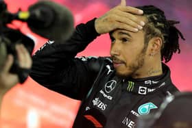 Second-placed Mercedes' British driver Lewis Hamilton reacts in the parc ferme of the Yas Marina Circuit after the Abu Dhabi Formula One Grand Prix on December 12, 2021 (Getty Images)