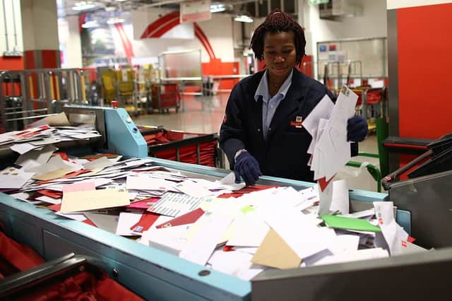 An employee sorts deliveries at Royal Mail's Mount Pleasant Mail Centre (Photo: Carl Court/Getty Images)