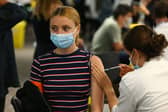 A woman receives a vaccine at the Chelsea F.C. pop up vaccine hub (Photo: Hollie Adams/Getty Images)