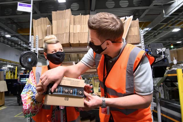 Podcasting husband and wife, Chris and Rosie Ramsey visit the team at AmazonÕs Fulfilment Centre in Tilbury, London to follow the journey of a product from one of AmazonÕs small business sellers, from production right through to delivery, to mark Prime Day, which begins on Monday June 21. Issue date: Monday June 14, 2021. PA Photo. Photo credit should read: Jonathan Hordle/PA Wire