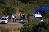 Portuguese Judicial Police criminal investigation unit members prepare at the base camp near the Arade dam, in Silves, on 24 May, 2023 on the second day of a new search operation amid the investigation into the disappearance of Madeleine McCann. (Photo by FILIPE AMORIM / AFP) (Photo by FILIPE AMORIM/AFP via Getty Images)