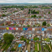Tasha Frootko and partner Stuart Doust have transformed a street by painting the houses bright colours in Gloucester.
