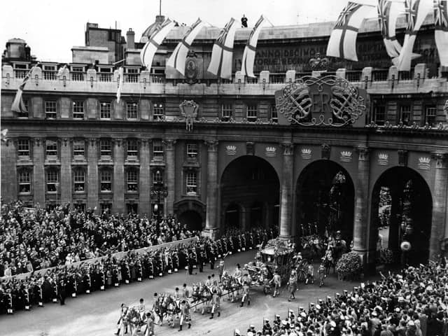 Queen Elizabeth II Coronation carriage and procession coming through Admiralty Arch on the way from Westminster Abbey to Buckingham Palace