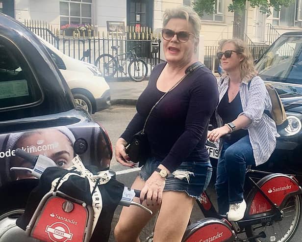 Suzy Eddie Izzard was spotted by a delighted fan careering around London on a Boris bike.