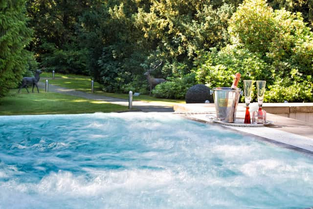 The outdoor pool and hot tub has glorious views