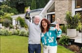 Darren & Rachael Reid - Omaze Million Pound House Surrey winners outside their new £3m home 