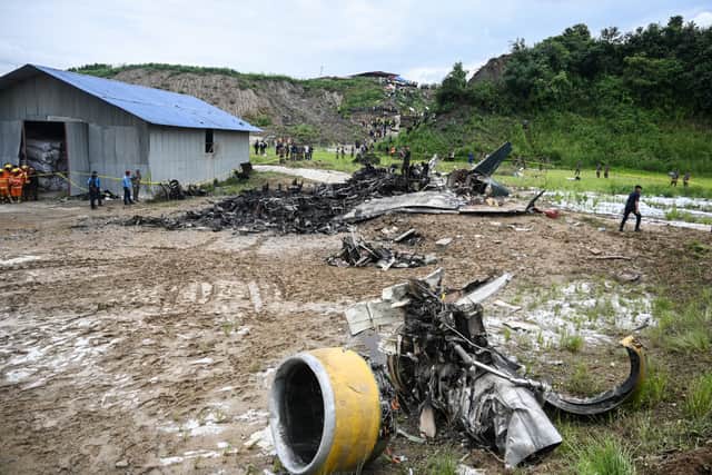 At least 18 people have been killed after a plane skidded off the runway and crashed while attempting take-off in Nepal. (Photo: AFP via Getty Images)