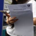 A student receives A-level results. 