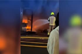 Sixty firefighters tackle blaze at kosher restaurant and flats.