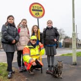 From the left - Elena Michalczuk, 11, Grace Pratt, 10, Cordelia Donald, 9, Amy Brooks, 11, with Klara Remmington and Bandit the cat.