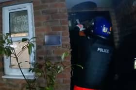 Body worn footage shows officers before a raid on a suspected gangster's home in West Midlands. 