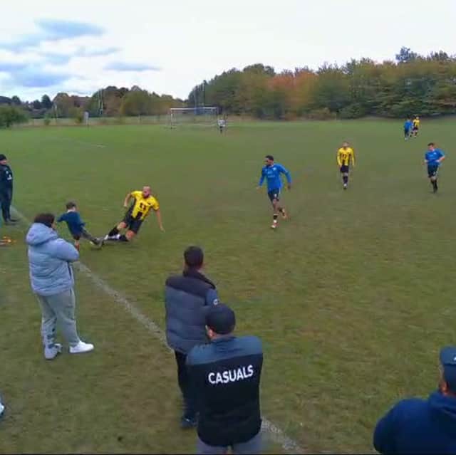 Reggie, 12, accidentally being slide tackled by non-league footballer Terry.
