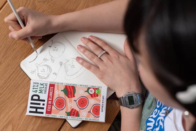 Louise Coutinho showcases the packaging design she contributed to for her winning chocolate bar
