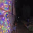 Video grab of a man snipping the Christmas lights at a property in Suffolk. 