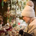 Shoppers at a Christmas market. 