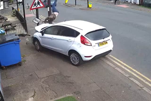 Mridhul Kombara, walking down the street when he is hit with a car.