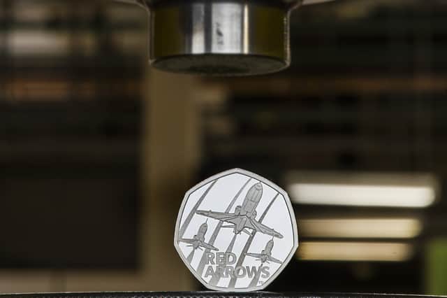 The Red Arrows 50p Coin depicts three Hawk T1 aircraft in flight