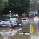 Cars stranded in deep water due to flooding in Stockport.
