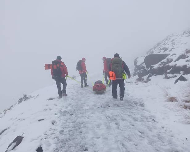 Injured man rescued from snow-covered mountain