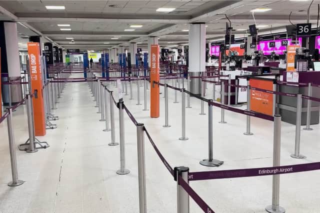 Check-in at Edinburgh Airport deserted.
