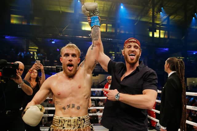 Jake Paul (left) and Logan Paul (right) have faced opponents in the ring over the years, but new social media posts have fans thinking a brotherly brawl could be on the cards.