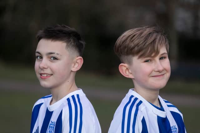 Flo Topham (L) and Camille Porhel, who play for York Railway Institute (YRI) AFC u12s Girls, have launched a campaign defending their right to have short hair, after they were accused of being boys during a game.