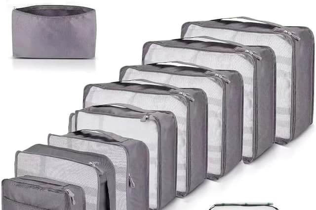 Set of grey waterproof packing cubes in multiple sizes for suitcase organisation