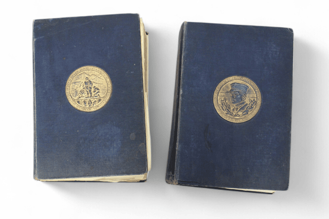 A signed copy of Captain Scott's The Voyage of The Discovery from 1905, addressed to Arthur Pilbeam.