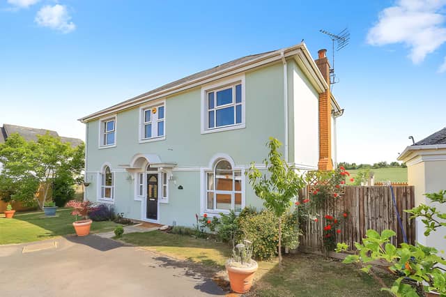 A private driveway and detached double garage give the five-bedroom family home a substantial arrival