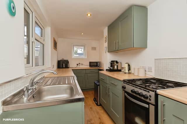 The newly fitted kitchen brings updated fittings, storage and workspace to the property