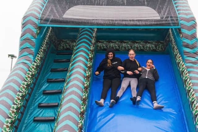 kids on inflatable slide