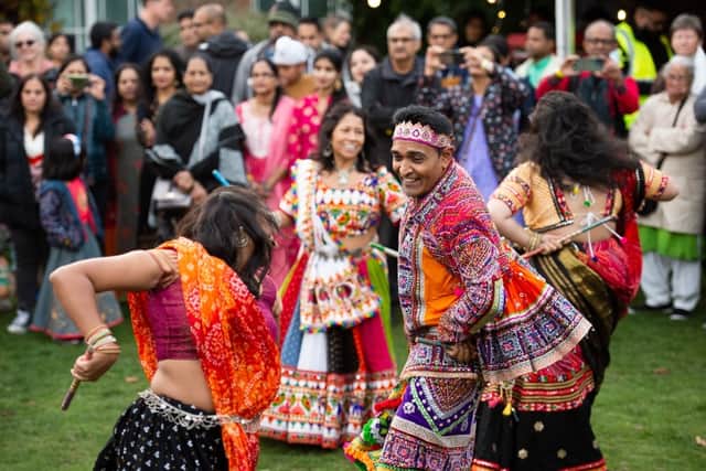 Music, dance, and colourful costumes brighten an Autumn day!