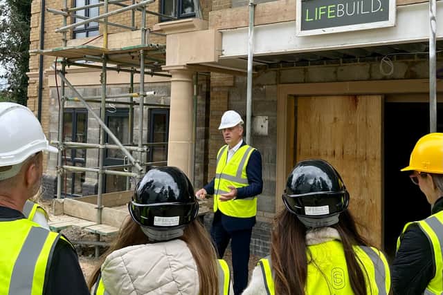 The Salveo Care team gathered on site at Wendover Manor to mark a milestone in construction.