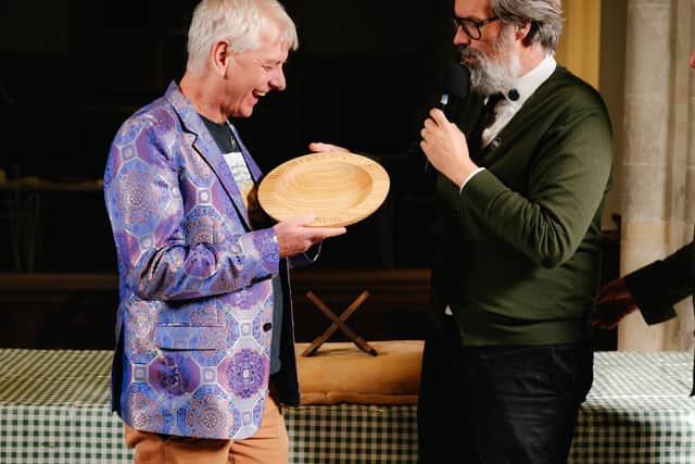 Roger receives award from Marcus Brigstocke