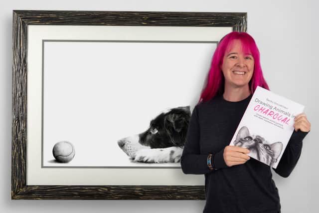 Becky with her book and "Patience" one of the drawings tutorials.